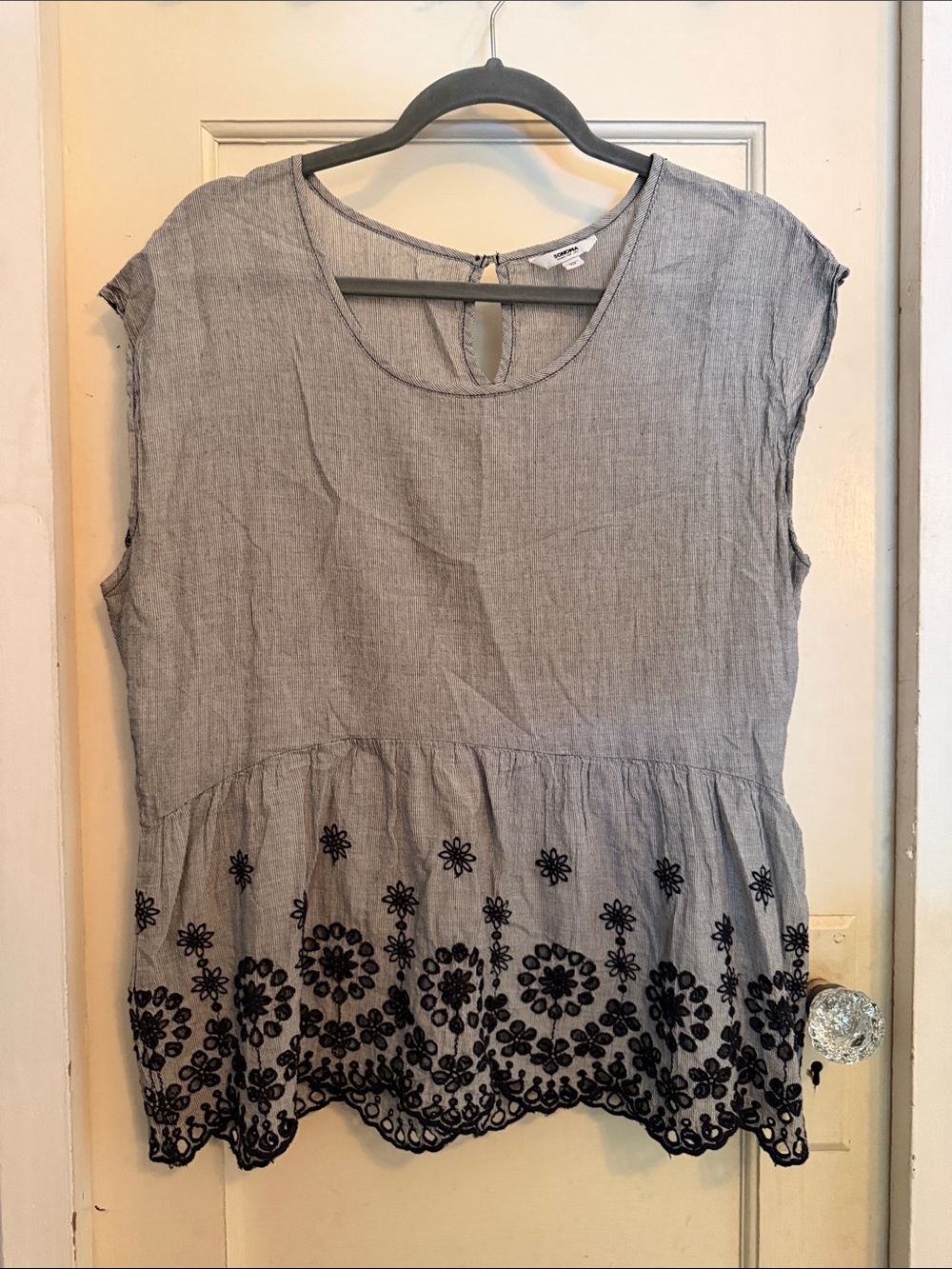 Sleeveless Gray Peplum Tunic with Black Floral Embroidery